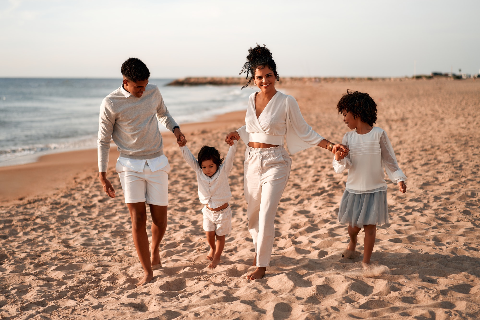 African American family on the beach on the weekend